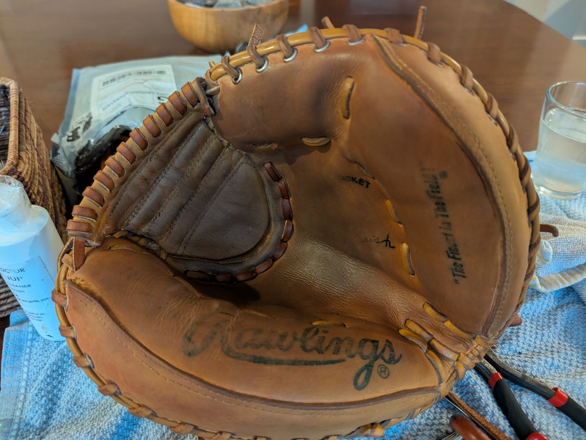 Rawlings catcher's mitt restored and relaced on the workbench