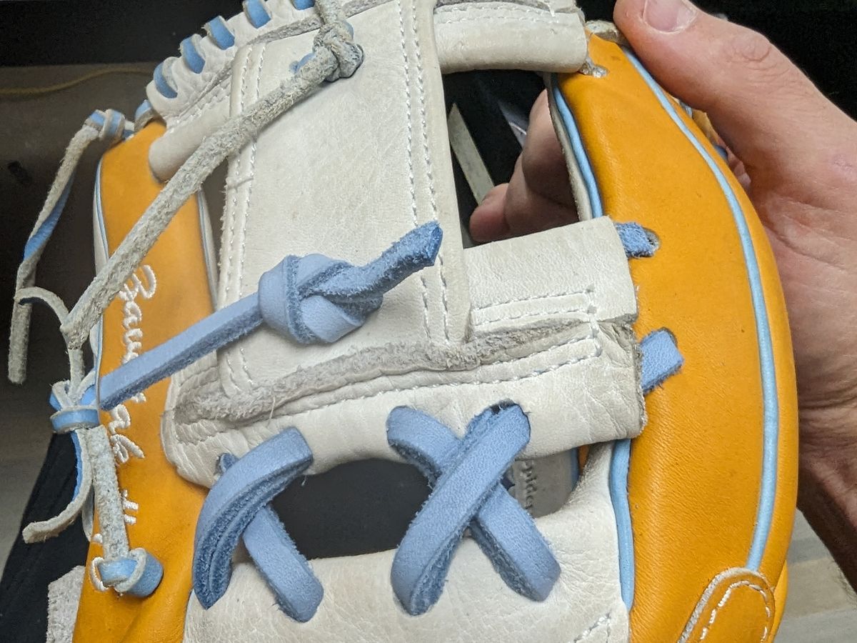Custom Columbia blue lace work on a Spiderz infield glove web